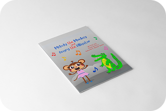 A photo of a Melody the Monkey book with a monkey and an alligator on the front.