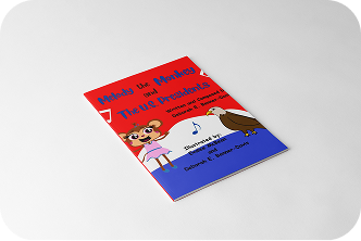 A photo of a red and blue Melody the Monkey book.